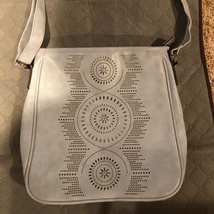 Light blue purse with ‘cut out’ front, never used